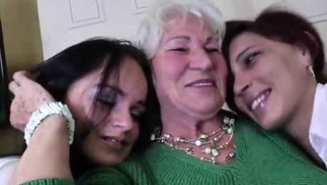 Granny Norma fucks two young lesbian girls